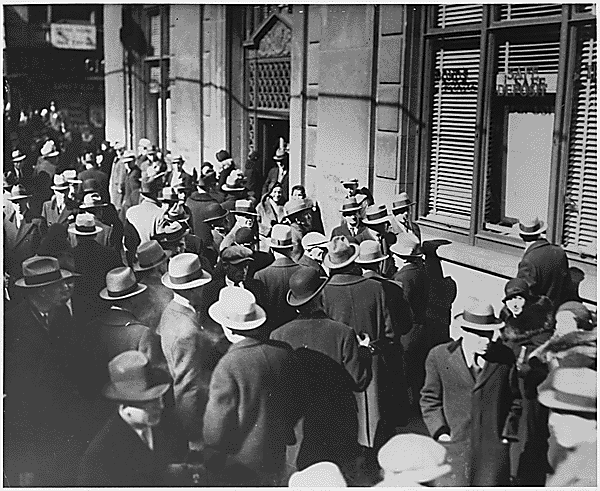 people queue outside a bank